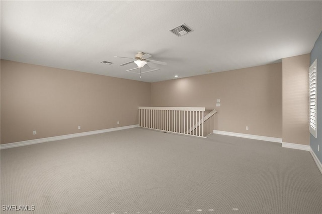 carpeted empty room with ceiling fan