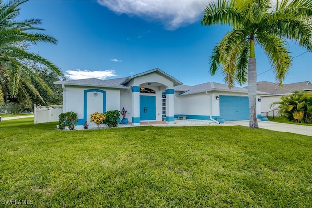 ranch-style home featuring driveway, a front yard, an attached garage, and stucco siding