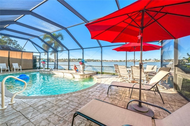 view of swimming pool with a jacuzzi, pool water feature, glass enclosure, a water view, and a patio area