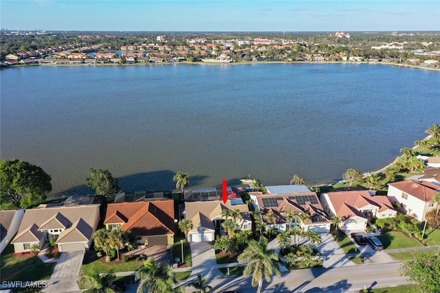 drone / aerial view with a water view