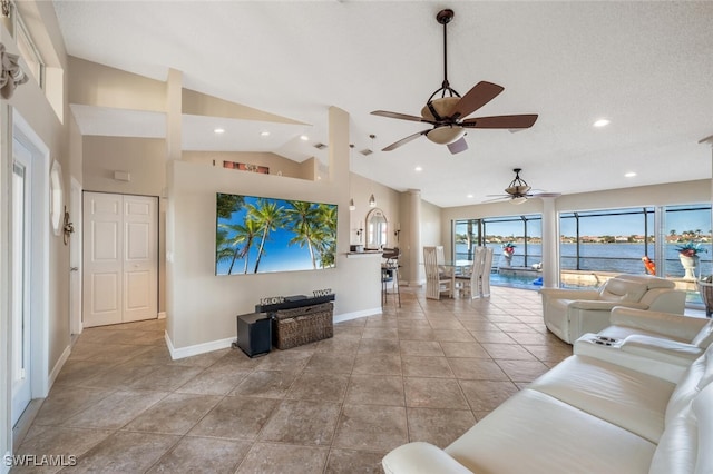 tiled living room with high vaulted ceiling