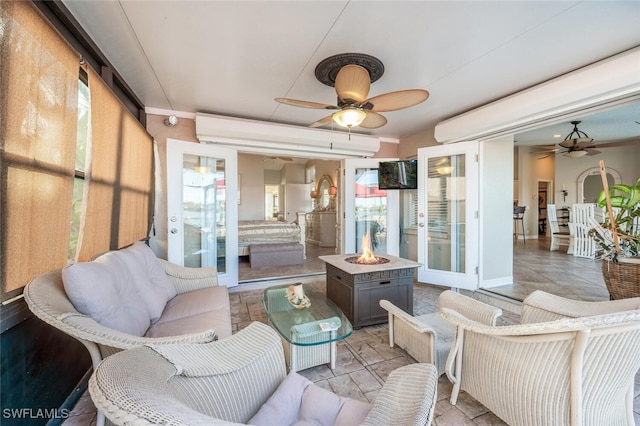 sunroom / solarium with ceiling fan