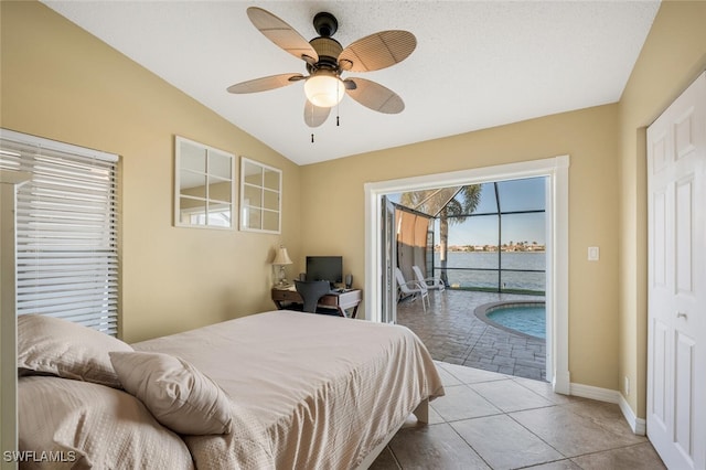 tiled bedroom with vaulted ceiling, access to outside, and ceiling fan