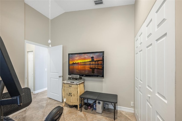 tiled living room with lofted ceiling