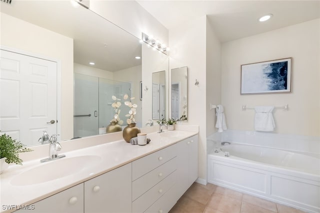 bathroom featuring vanity, separate shower and tub, and tile patterned flooring