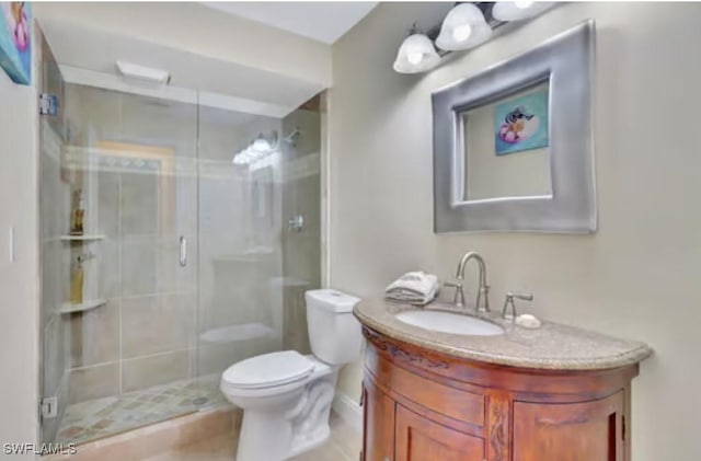 116 Capri Blvd, Naples, FL 34113 - bathroom featuring vanity, toilet, and a stall shower