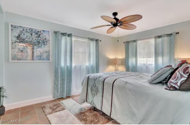 116 Capri Blvd, Naples, FL 34113 - bedroom with baseboards, a ceiling fan, and tile patterned flooring