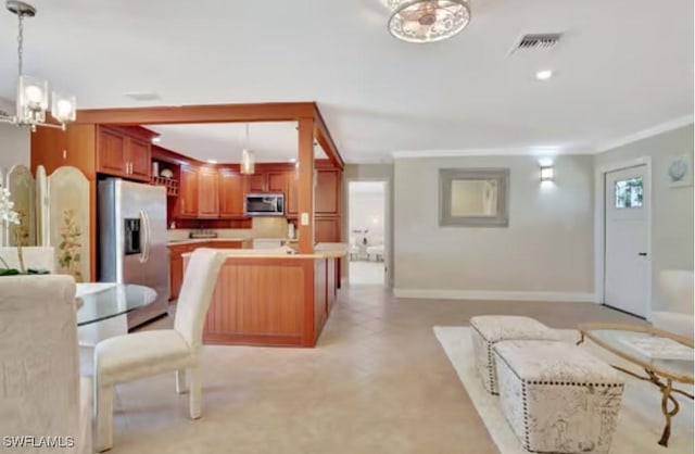 116 Capri Blvd, Naples, FL 34113 - interior space featuring visible vents, crown molding, open floor plan, appliances with stainless steel finishes, and a notable chandelier