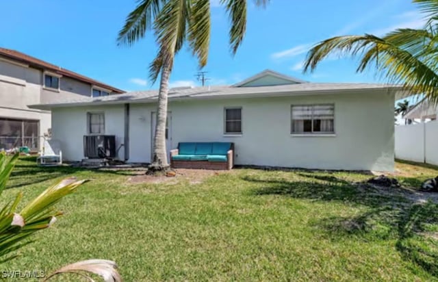 116 Capri Blvd, Naples, FL 34113 - rear view of house with stucco siding, a lawn, cooling unit, and fence