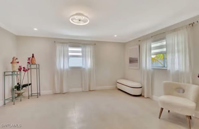 116 Capri Blvd, Naples, FL 34113 - living area with recessed lighting and baseboards