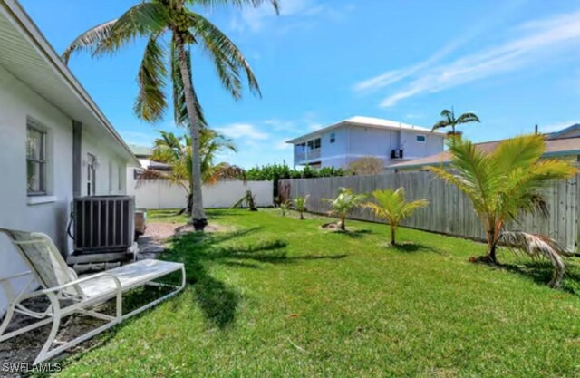 116 Capri Blvd, Naples, FL 34113 - view of yard with central AC and a fenced backyard