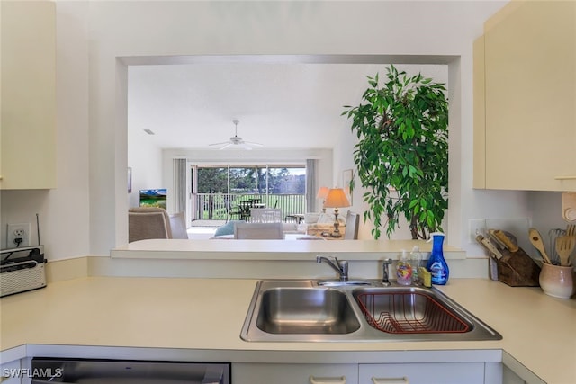 kitchen with dishwashing machine, sink, and ceiling fan