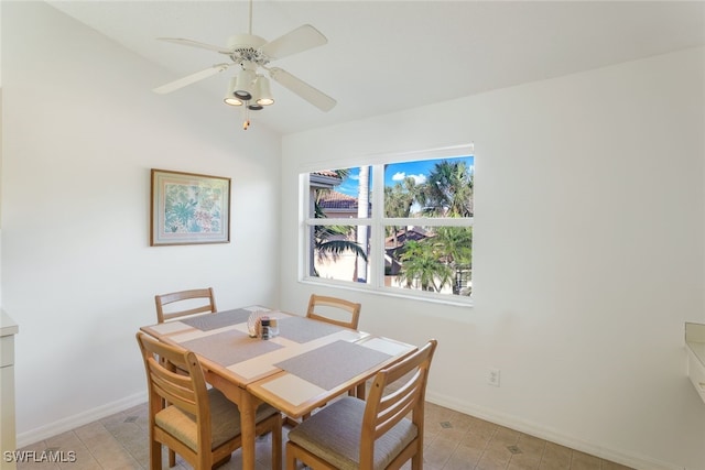 tiled dining space featuring ceiling fan