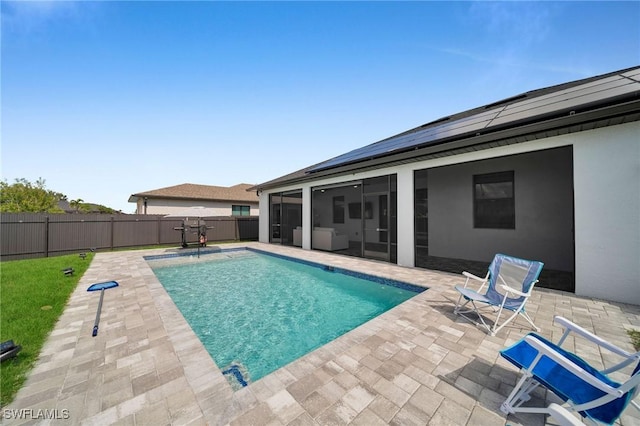 view of swimming pool with a patio area