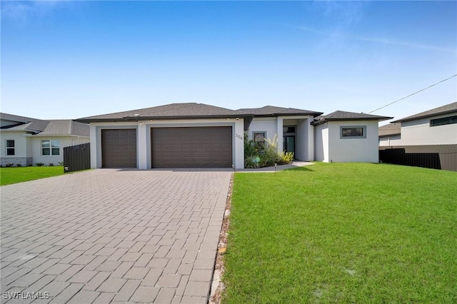 view of front facade featuring a garage and a front yard