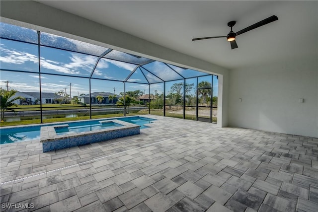 view of swimming pool with an in ground hot tub, a water view, a lanai, and a patio