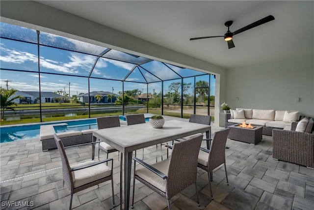 view of patio with a water view, an outdoor hangout area, and glass enclosure