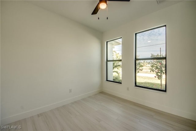 unfurnished room featuring light hardwood / wood-style floors and ceiling fan