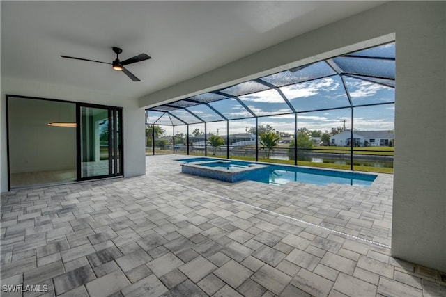 view of swimming pool featuring an in ground hot tub, a water view, a lanai, and a patio area