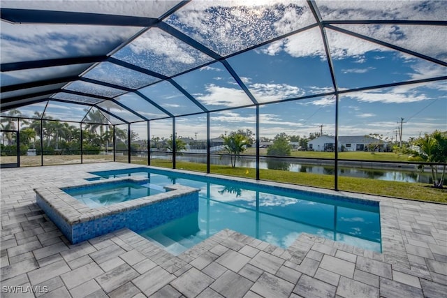 view of swimming pool with a patio area, a water view, glass enclosure, and an in ground hot tub