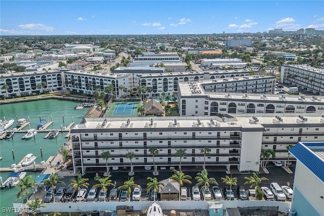 birds eye view of property with a water view