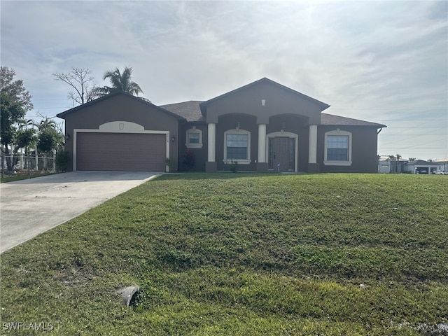 view of front facade featuring a garage and a front yard