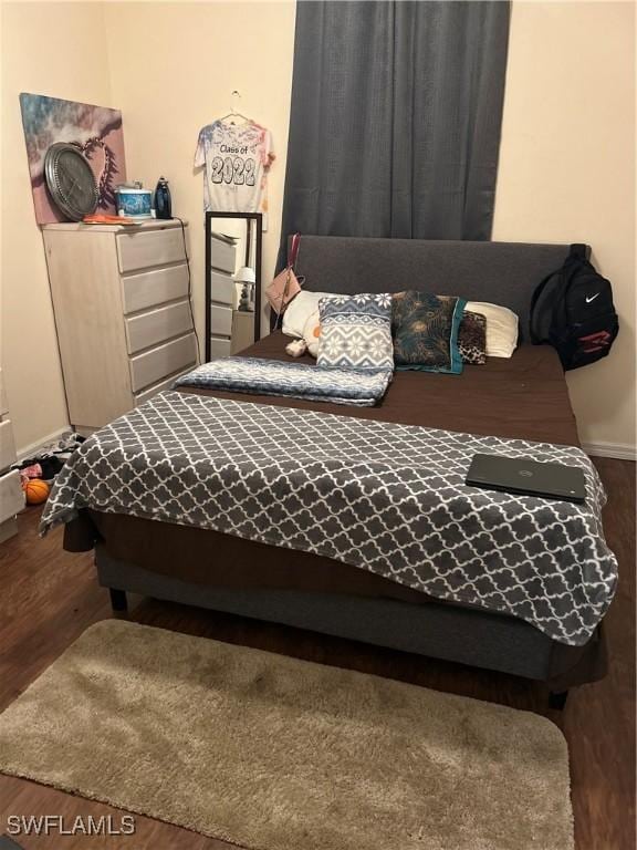 bedroom featuring hardwood / wood-style flooring