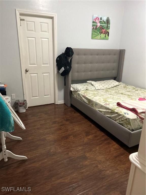 bedroom featuring dark hardwood / wood-style flooring