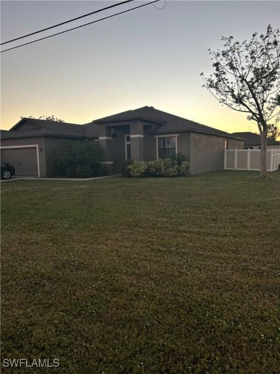 view of front of house featuring a lawn