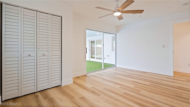 unfurnished bedroom featuring access to outside, ceiling fan, and light hardwood / wood-style flooring