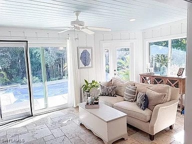 sunroom with plenty of natural light and ceiling fan