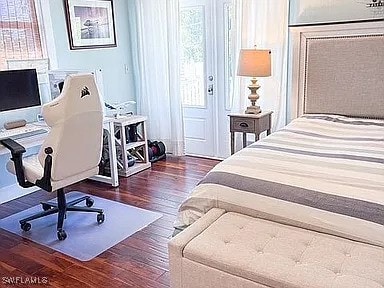 bedroom featuring dark hardwood / wood-style flooring