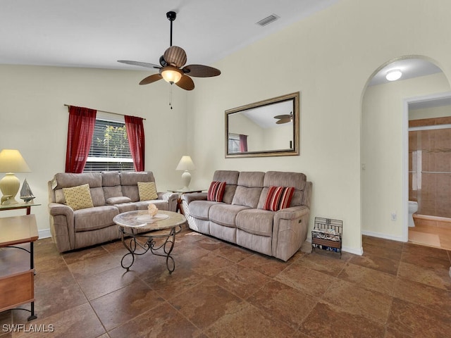 living room featuring lofted ceiling and ceiling fan