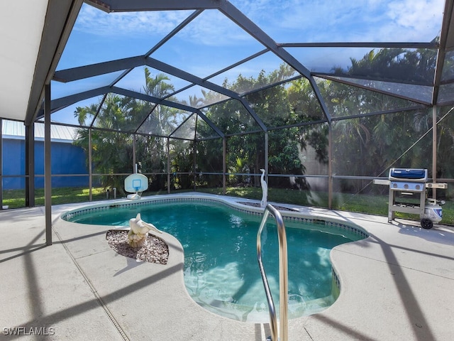 view of pool with a grill, a patio, and glass enclosure