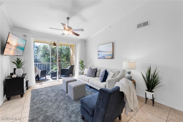 tiled living room featuring crown molding, ceiling fan, and lofted ceiling