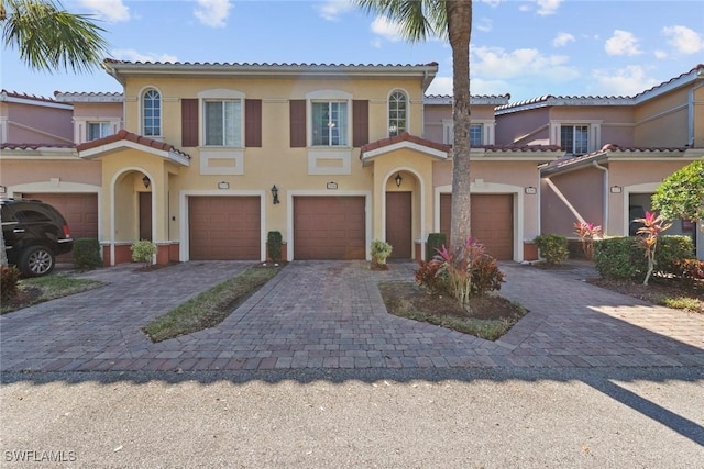 mediterranean / spanish-style home featuring a garage