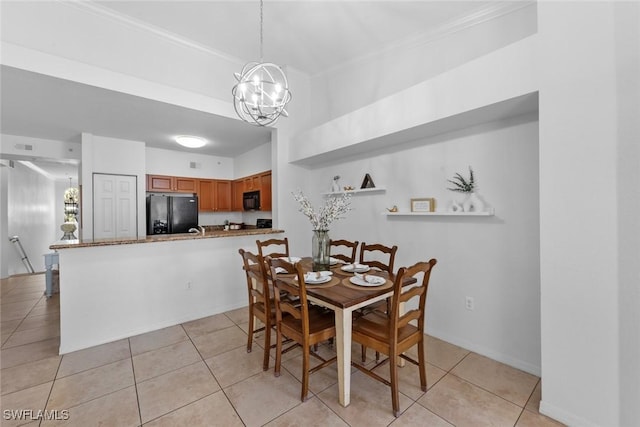 dining area with crown molding, light tile patterned floors, and a notable chandelier