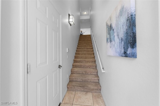 stairway with tile patterned flooring