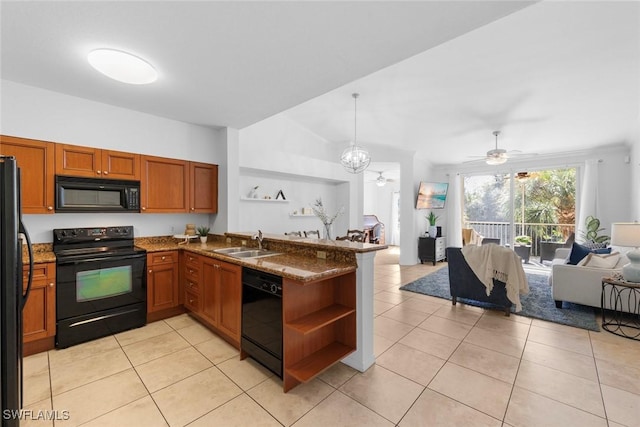 kitchen with sink, light tile patterned floors, black appliances, and kitchen peninsula