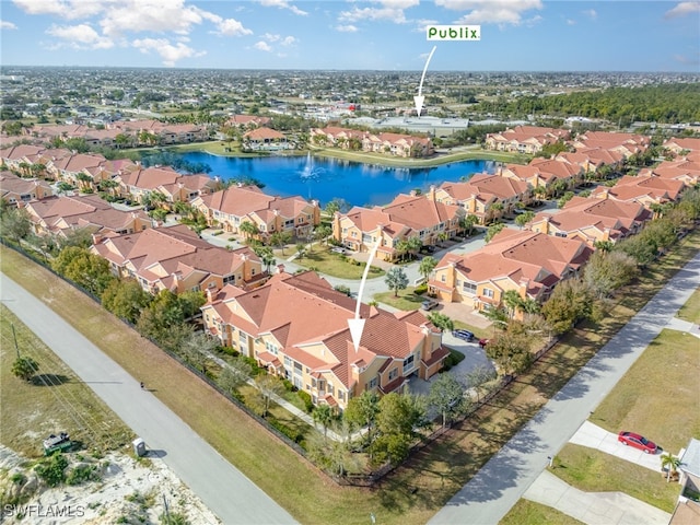 birds eye view of property featuring a water view