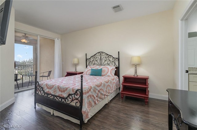 bedroom with dark wood-type flooring and access to outside