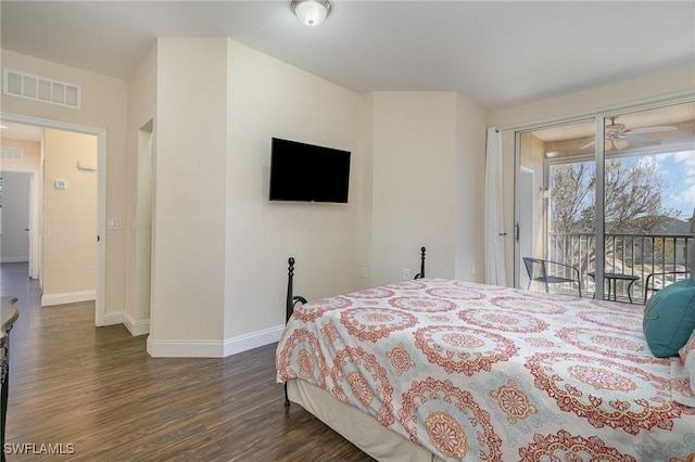 bedroom featuring dark hardwood / wood-style floors and access to outside