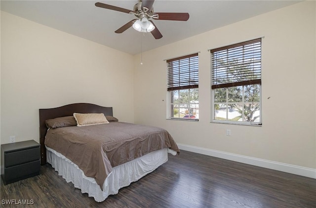 bedroom with ceiling fan and dark hardwood / wood-style flooring