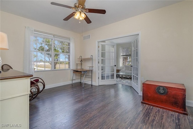 sitting room with ceiling fan, dark hardwood / wood-style flooring, and french doors