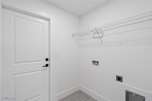 laundry area featuring wood-type flooring, washer hookup, and hookup for an electric dryer