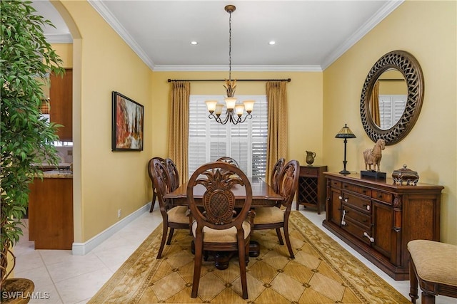 dining space with ornamental molding, light tile patterned floors, and an inviting chandelier