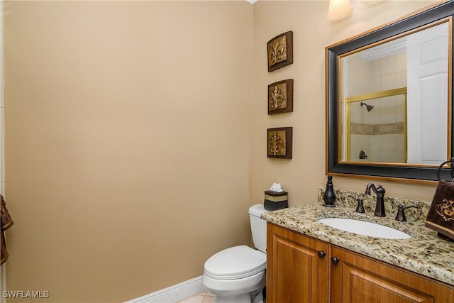 bathroom with vanity, an enclosed shower, and toilet