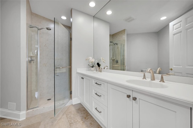 bathroom with vanity and an enclosed shower