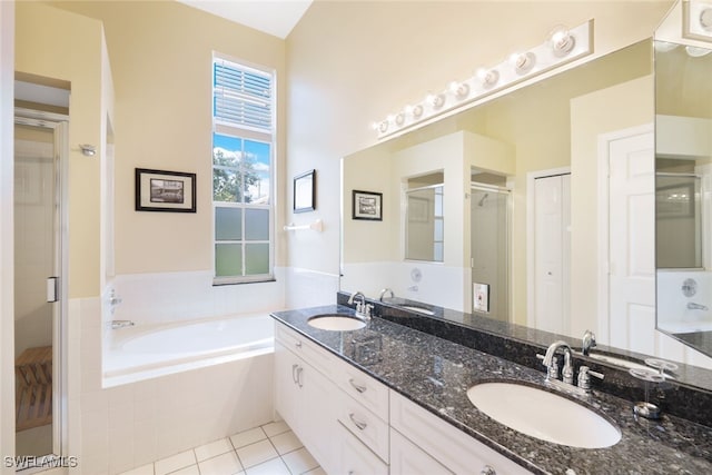 bathroom featuring shower with separate bathtub, tile patterned floors, and vanity