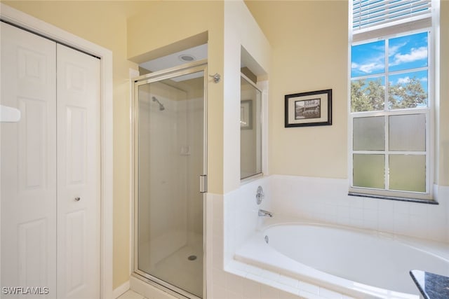 bathroom featuring plus walk in shower